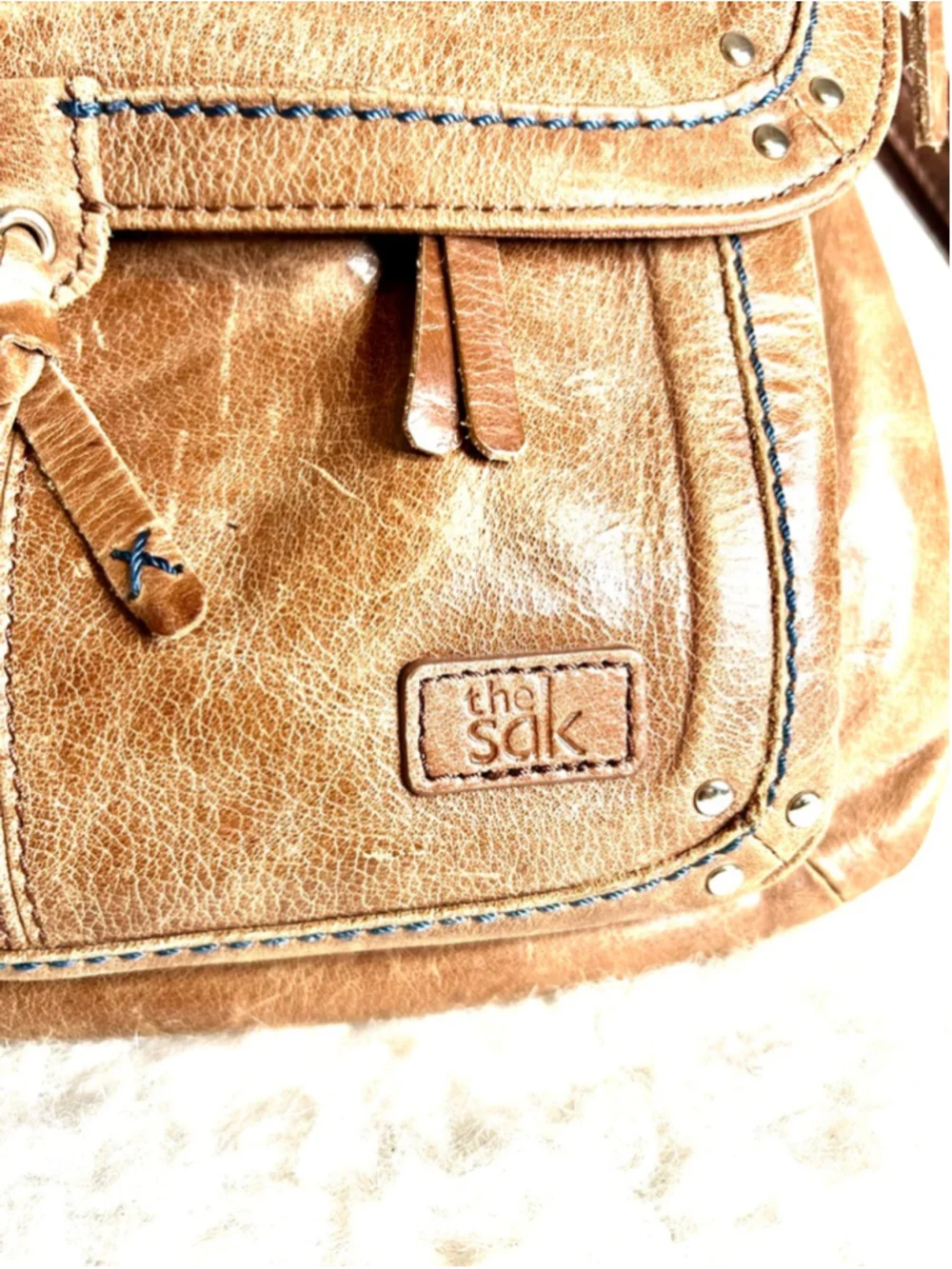 The Sak Ventura Leather Convertible Backpack in a brown, distressed leather